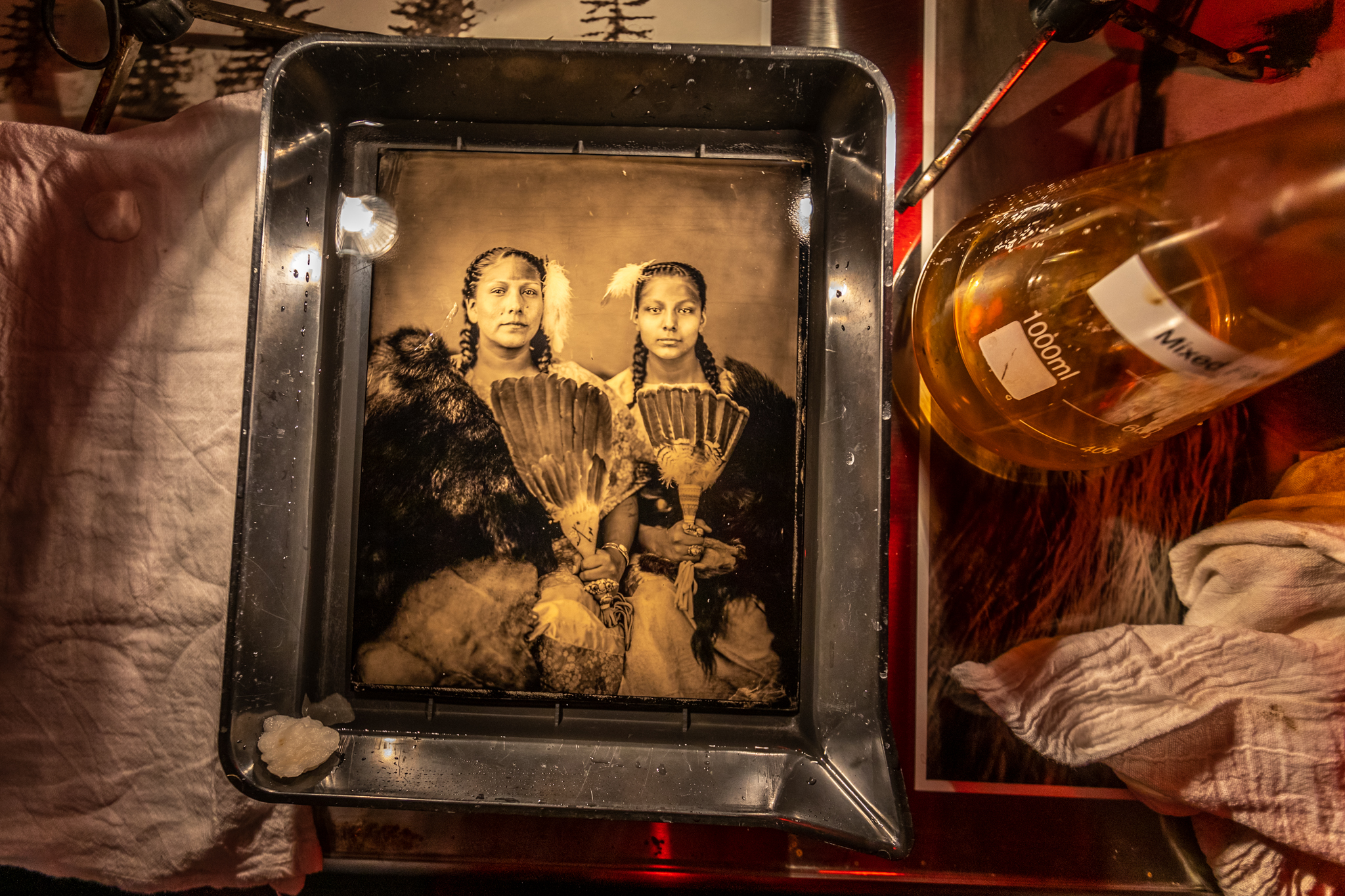 Wet plate of Gloria and Floris White Bull being developed at studio of Shane Balkowitsch