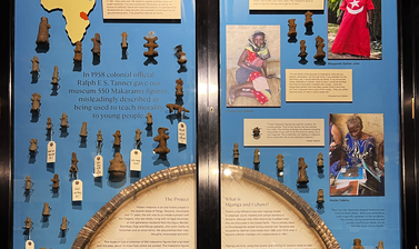 Detail of the Hidden Histories display showing small clay figures against a blue background, with text labels.