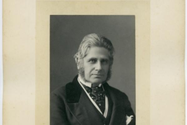 framed portrait photo of a smartly dressed older man