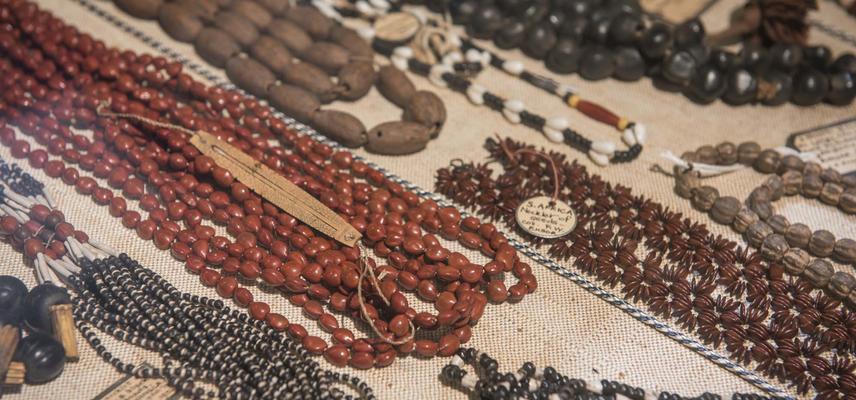 close-up of a cabinet filled with a range of necklaces