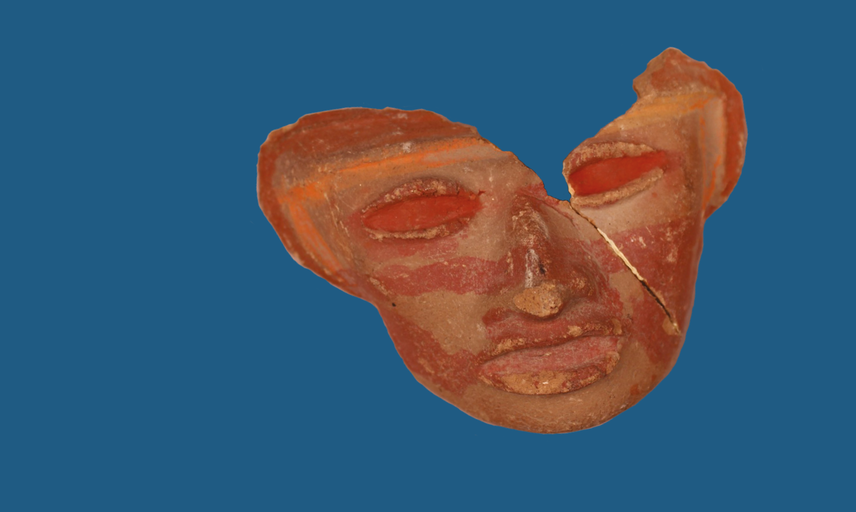 A ceramic mask showing a face, with a diagonal crack shown across the right side and triangular piece missing from the forehead