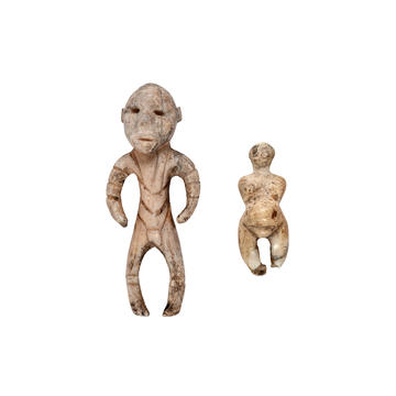 Ivory figures of a man and woman Small humanoid carvings