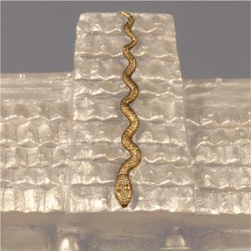 A bronze python on a bronze roof structure